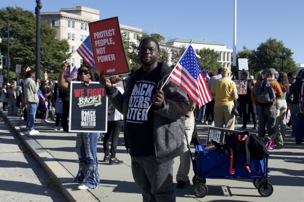 Voting Rights Act supporters rally outside Supreme Court as justices hear Louisiana case 1 Brandon Parnell, 39, and Latoya Gaines, 40, both of Birmingham, Alabama, traveled to Washington, D.C., to demonstrate outside the U.S. Supreme Court on Wednesday, Oct. 15, 2025. (Photo by Ashley Murray/States Newsroom)