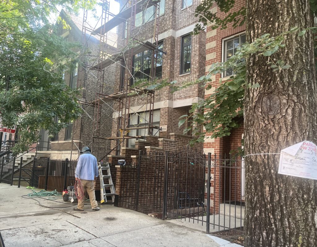 Cities turn to AI to speed housing permitting 1 A person works on a condominium in Chicago. Some U.S. cities are trying to modernize the housing permitting process by adopting AI tools. (Photo by Robbie Sequeira/Stateline)